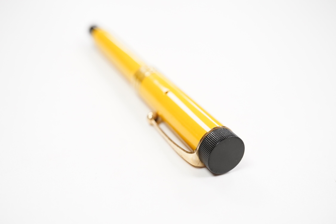 A Parker Lucky Curve Junionette in Mandarin yellow - mint pen but without barrel imprint which possibly left factory without one